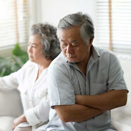 Mature Asian Couple Contemplating Divorce Options