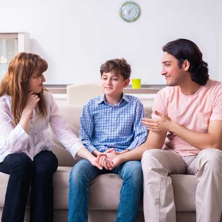 Mother and Father talking to their son about divorce